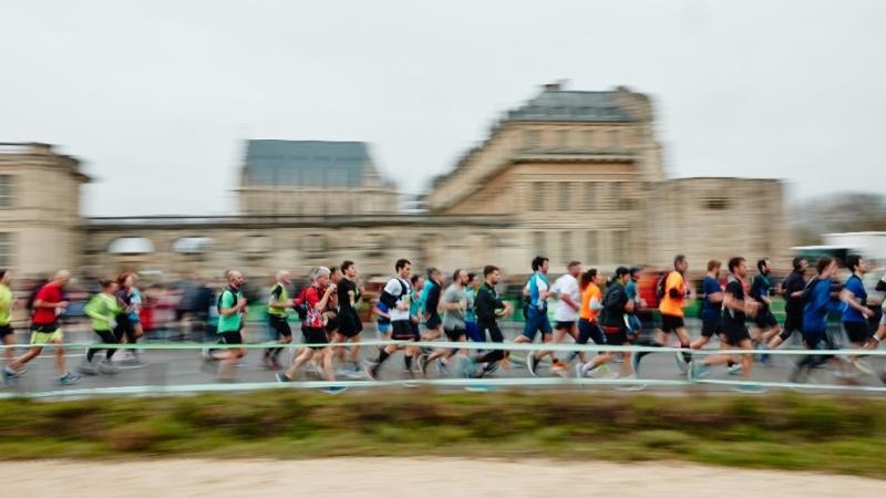 group of runners running at paris marathon