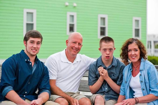 man with down syndrome and his family