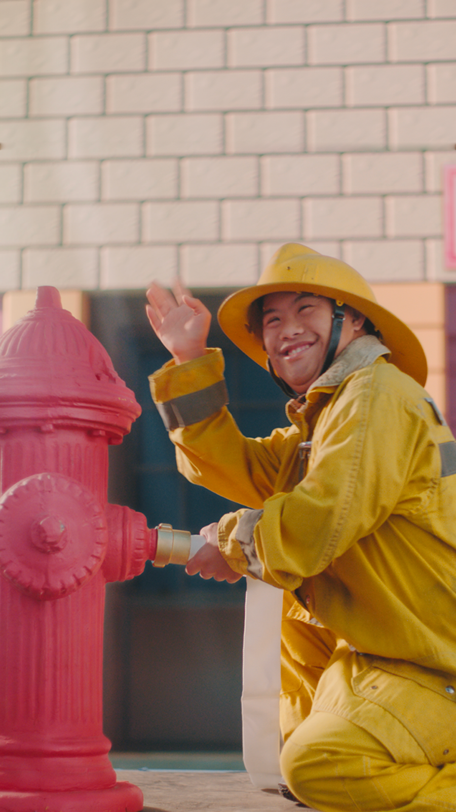 Man in firefighter gear next to fire hydrant