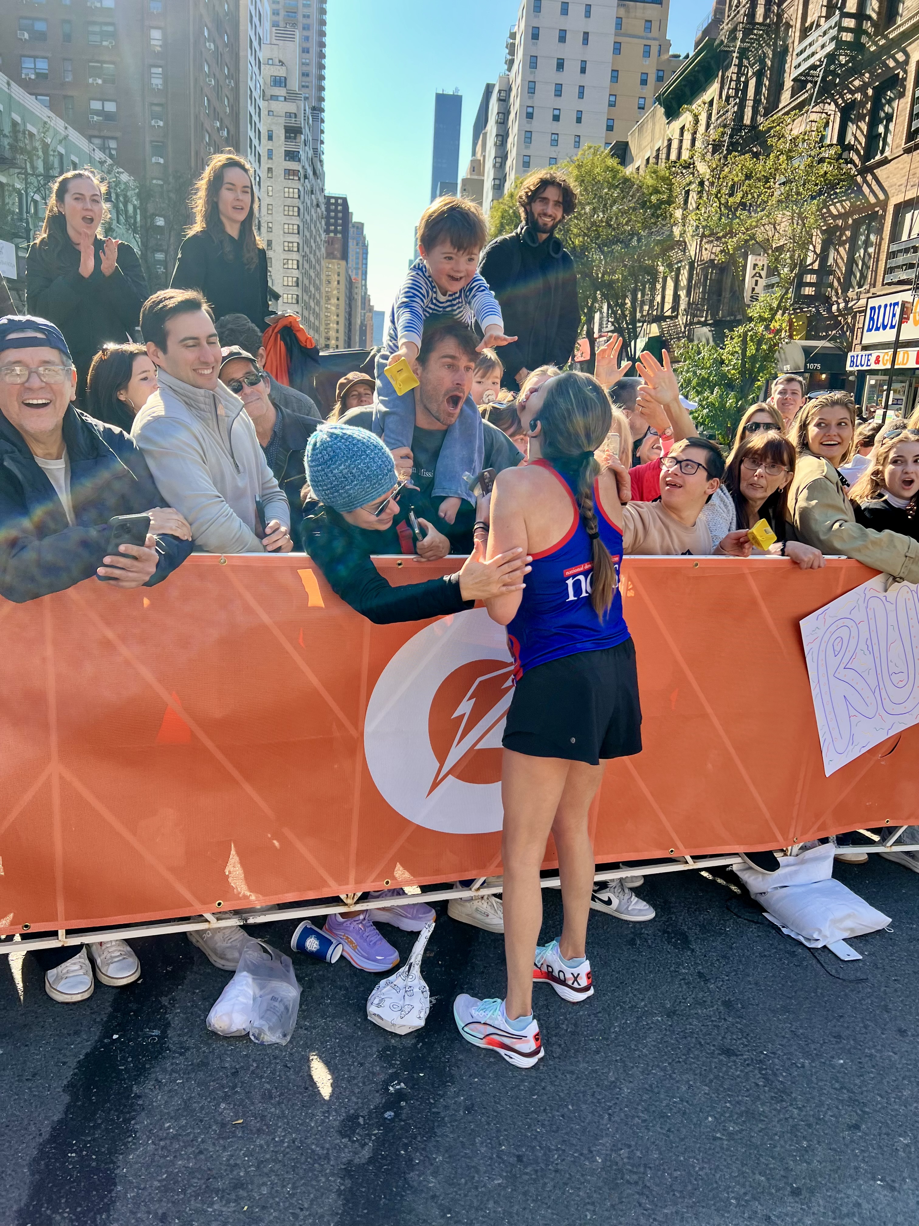 Mom meets child with Down syndrome cheering her on at the NYC Marathon