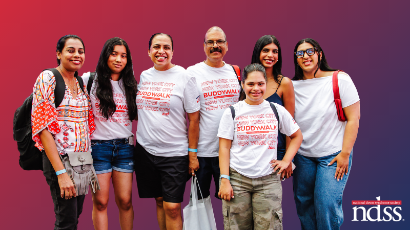 Photo of a young woman with Down syndrome and her family wearing NYC Buddy Walk® t-shirts. NDSS logo.