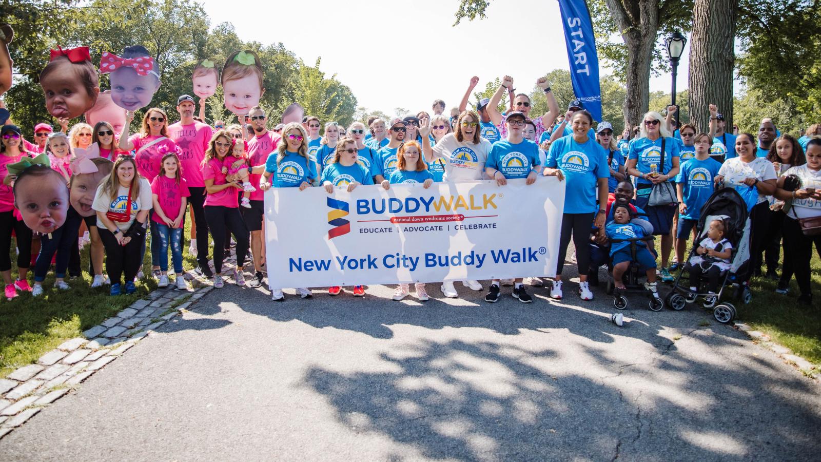 Grand marshals and walkers kicking off nyc buddy walk with banner