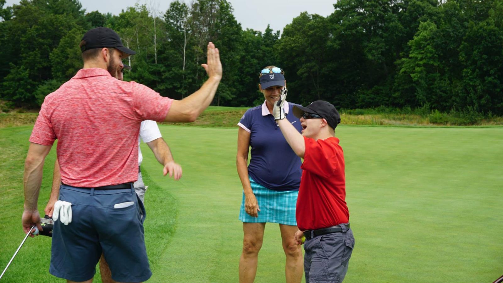 Golfer giving high fives