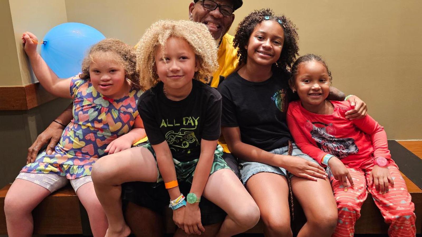 Family of five pose together at Family Weekend 2025