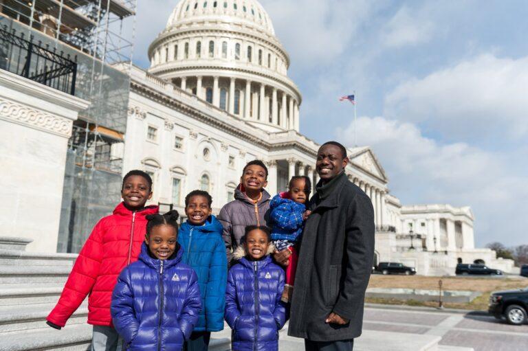 Family stands in front of US Capitol