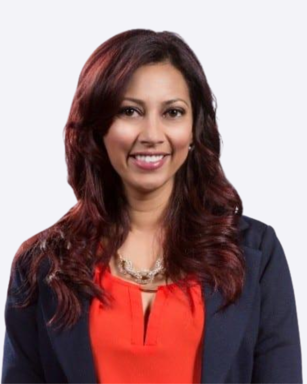 Headshot of LaSandra Brill, a woman with dark red hair, a bright pink blouse, and a black blazer.