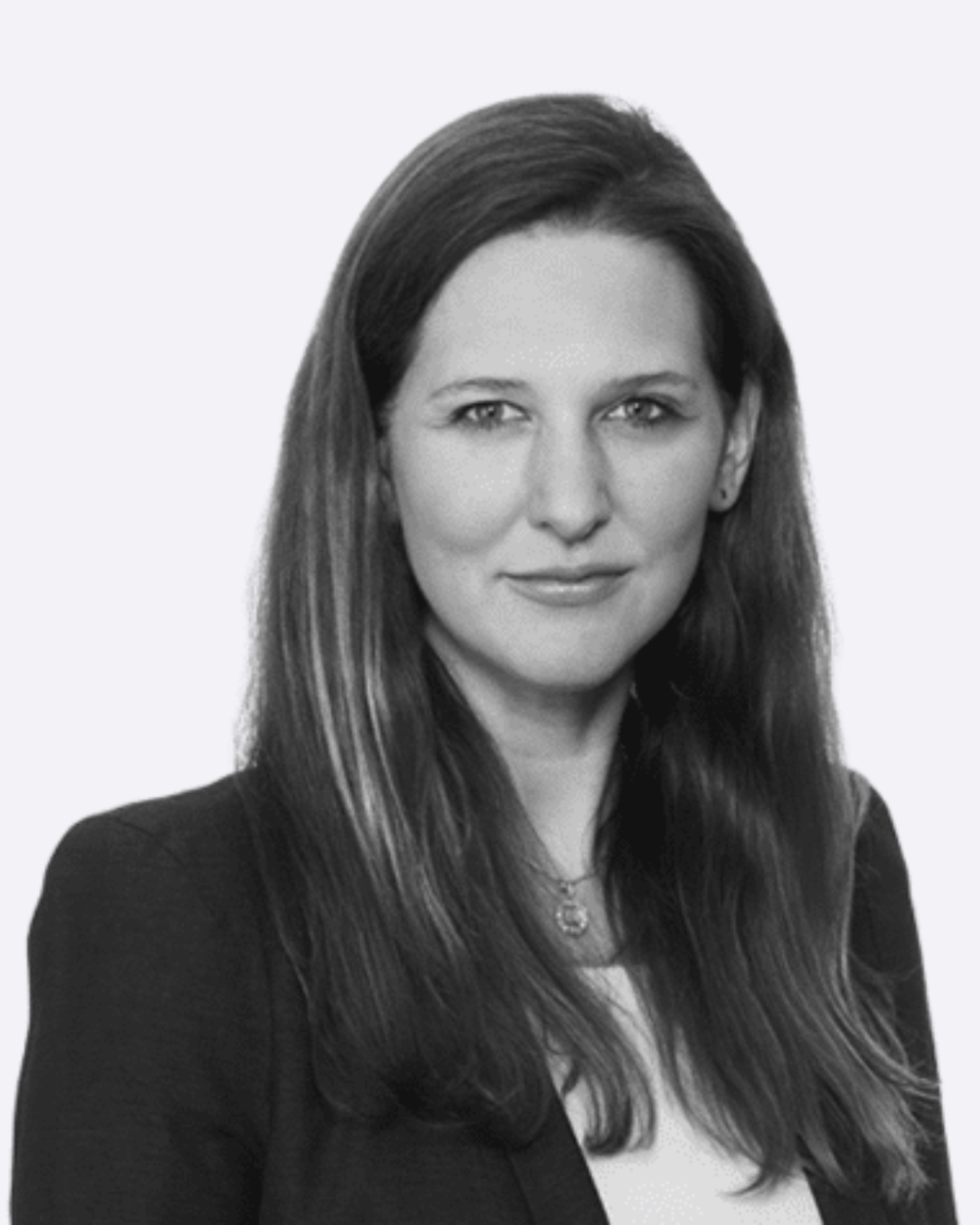 Black and white headshot of Ludivine Van Der Heyden, a woman wearing a light blouse and dark blazer.