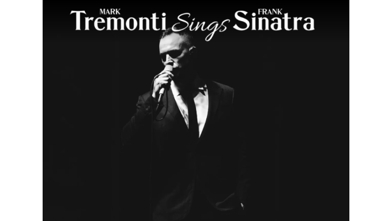 Mark Tremonti Sings Frank Sinatra. Black and white photo of Mark Tremonti singing.