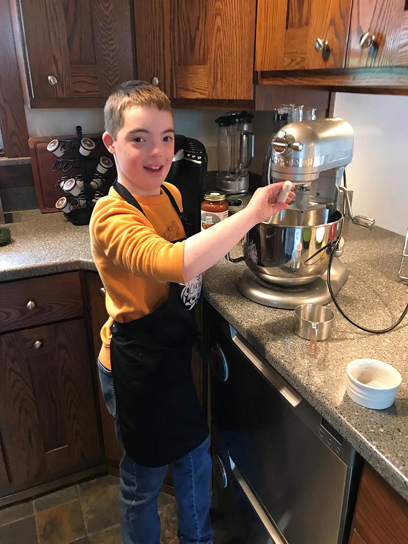 Jack Kelly working in the kitchen