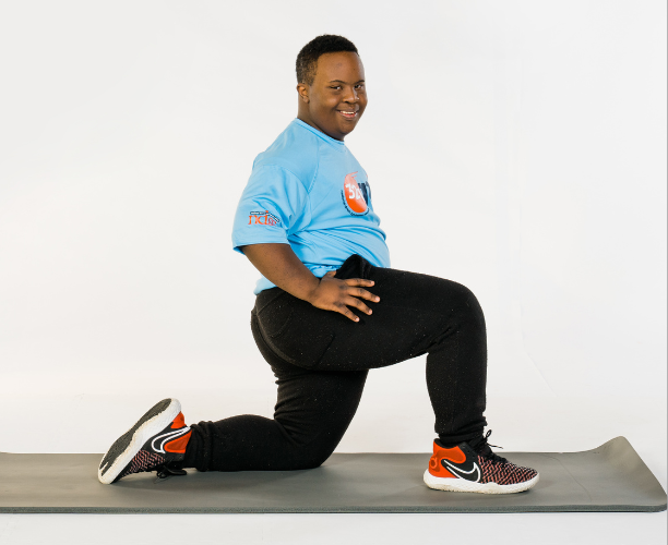 Young man doing stretches wearing 321 Go! shirt