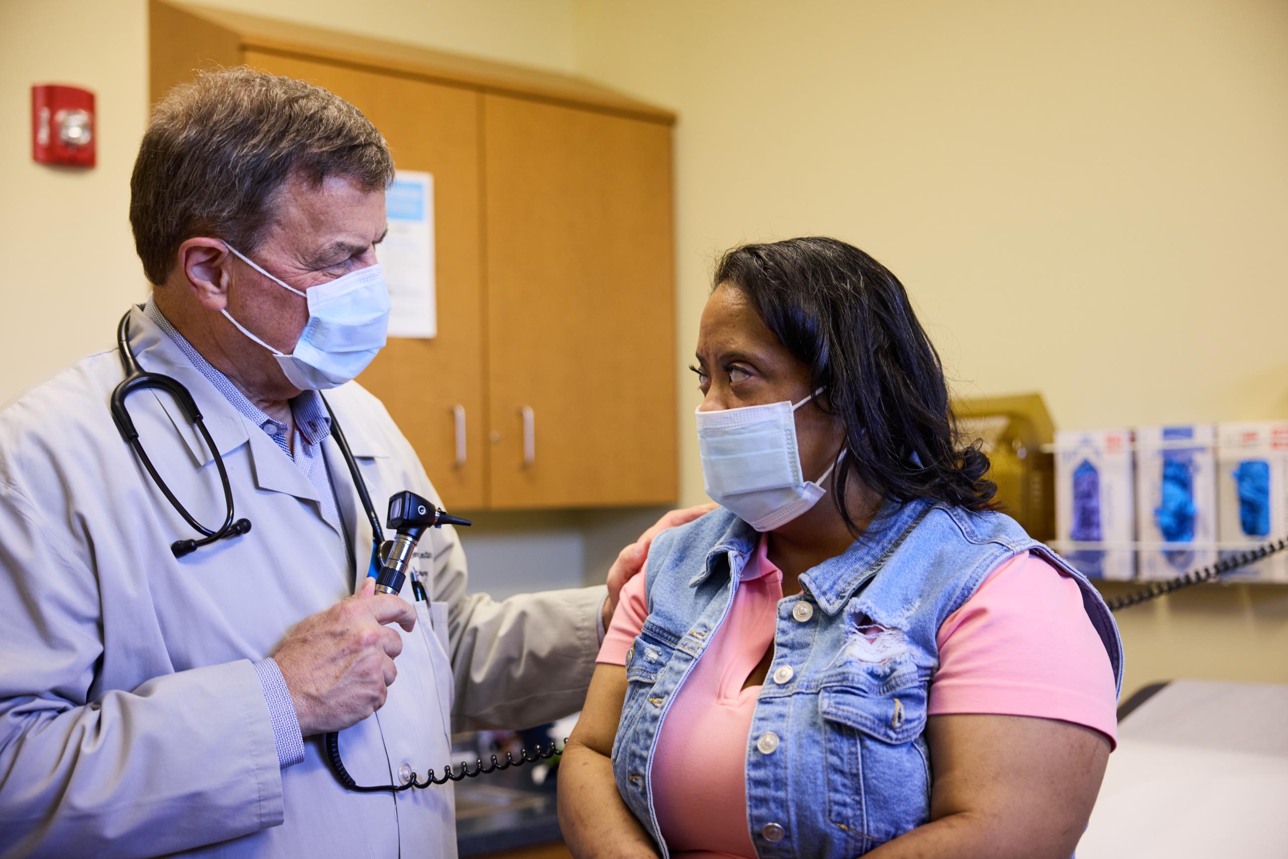Woman with Down syndrome meets with her doctor.
