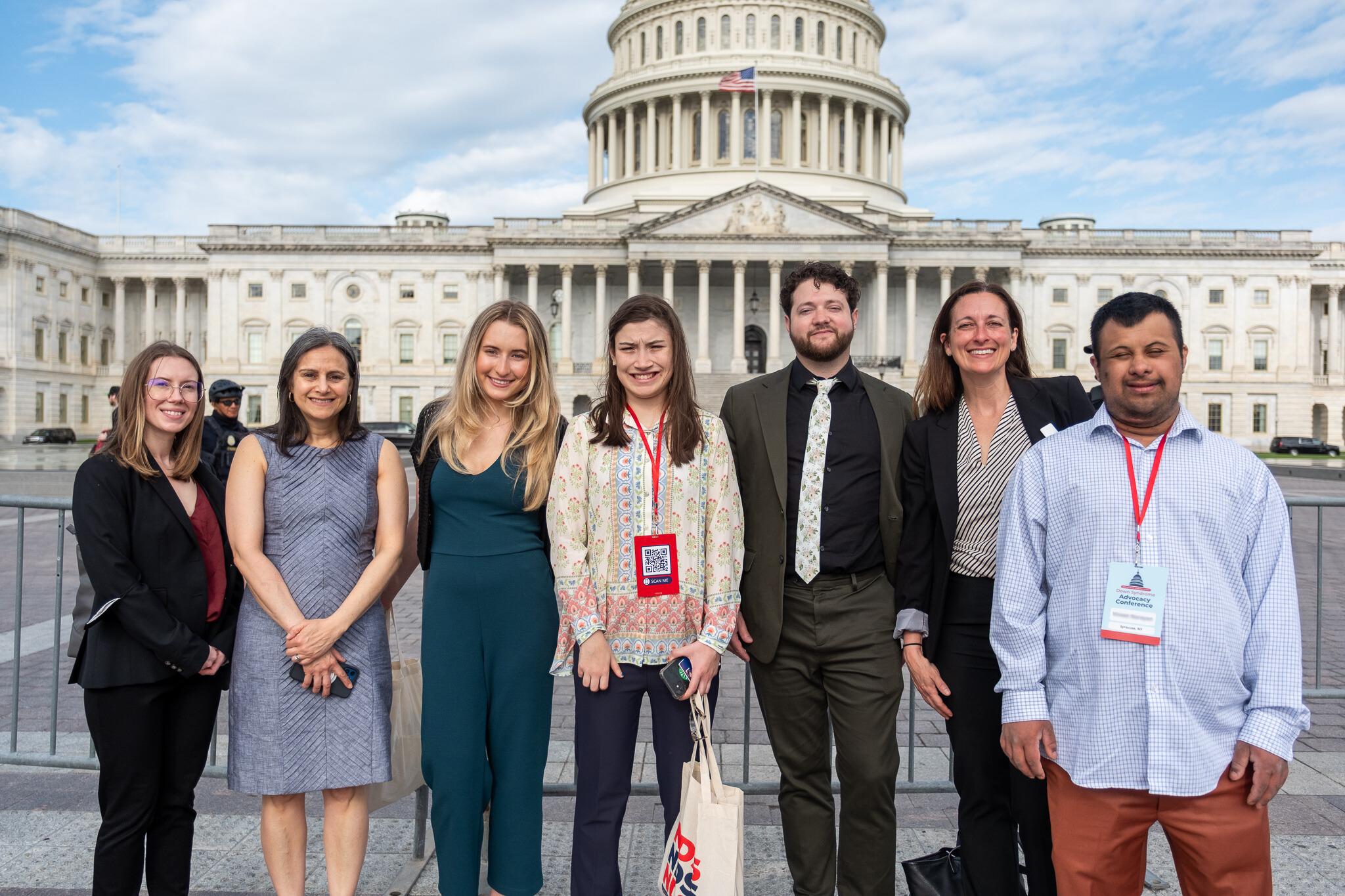Groups of advocates pose in front of the US Capitol Building