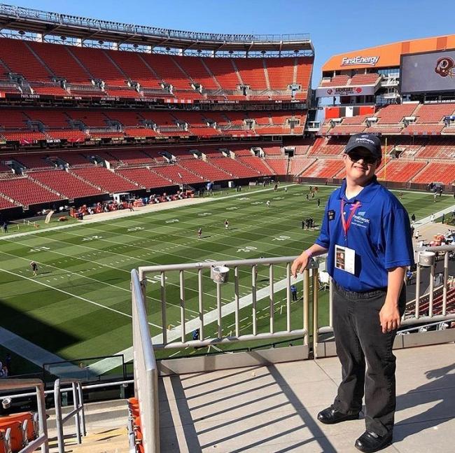 Man with Down syndrome standing in Cleveland Browns stadium