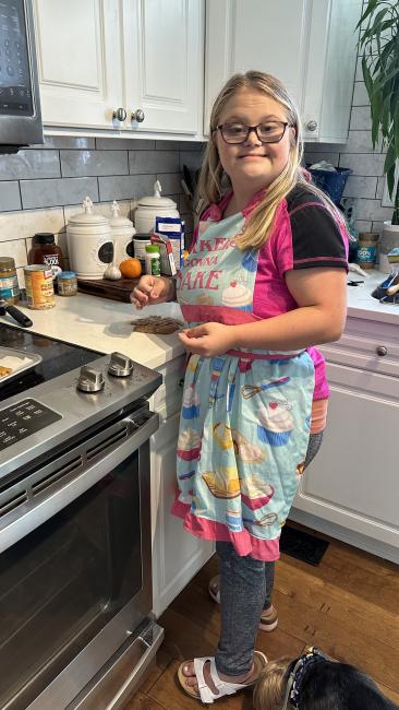 woman with Down syndrome baking a treat