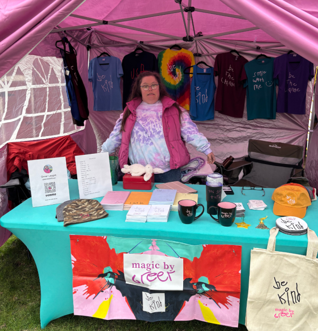 Greer Leggat, a woman with Down syndrome, stands at her business stand