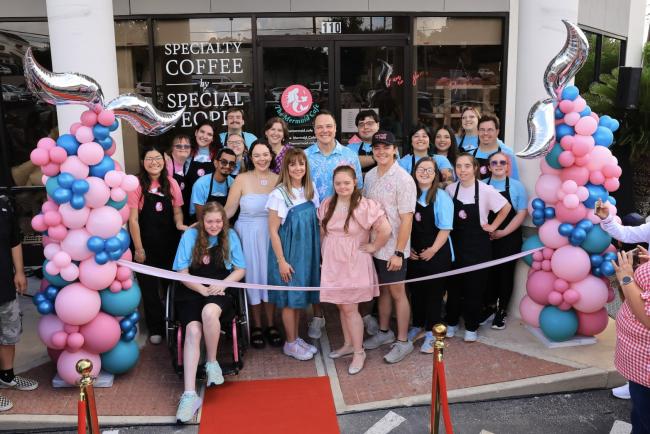 Group of employees with disabilities at the grand opening of The Mermaid Cafe
