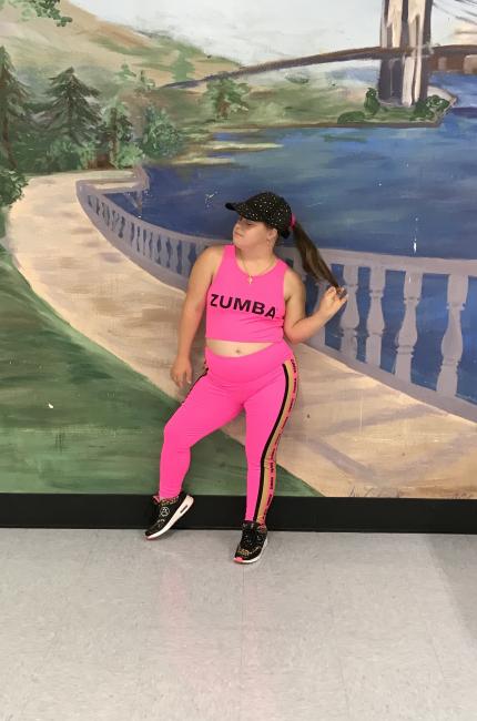 Sandy Morten, a woman with Down syndrome, wears a Zumba top