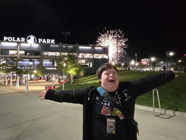 Tucker, a man with Down syndrome, celebrates the fireworks at Polar Park