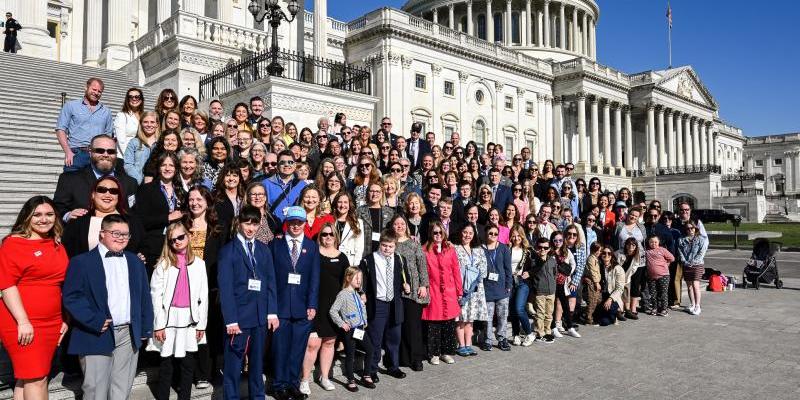 group of advocates for down syndrome gathering in front of Capitol Hill